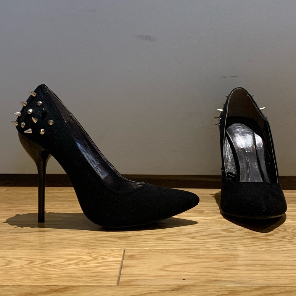 Black suede-like pumps with studded detailing